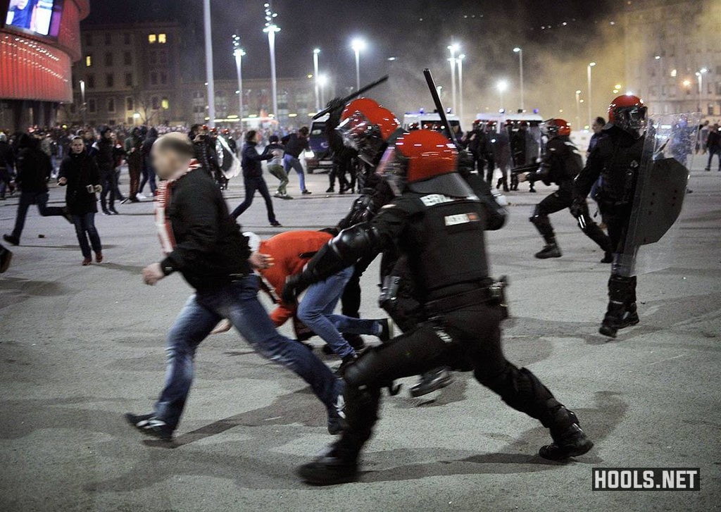 Spanish riot police use batons to hit Spartak Moscow fans