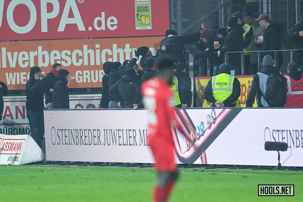 RW Essen and Osnabruck fans fight inside the Bremer Brucke stadium after the final whistle of their 3. Liga match.