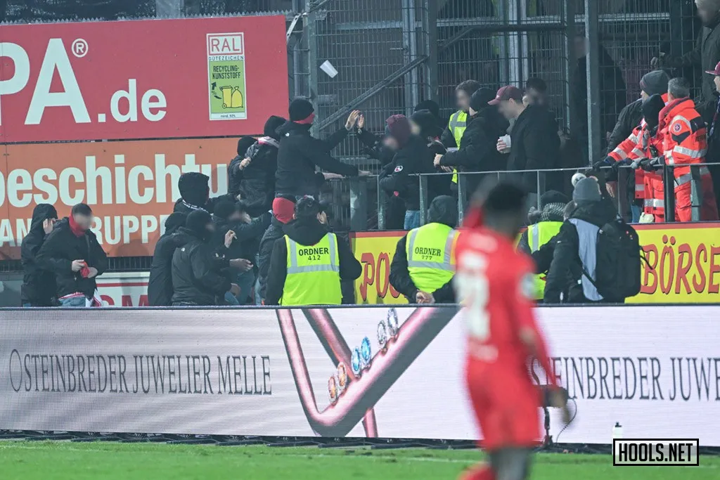 RW Essen and Osnabruck fans fight inside the Bremer Brucke stadium after the final whistle of their 3. Liga match.