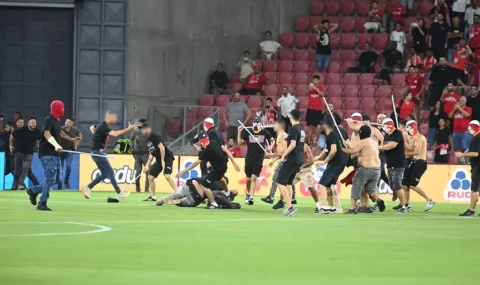 Hapoel Beer Sheva and Bnei Sakhnin fans clash on pitch prior to kick-off